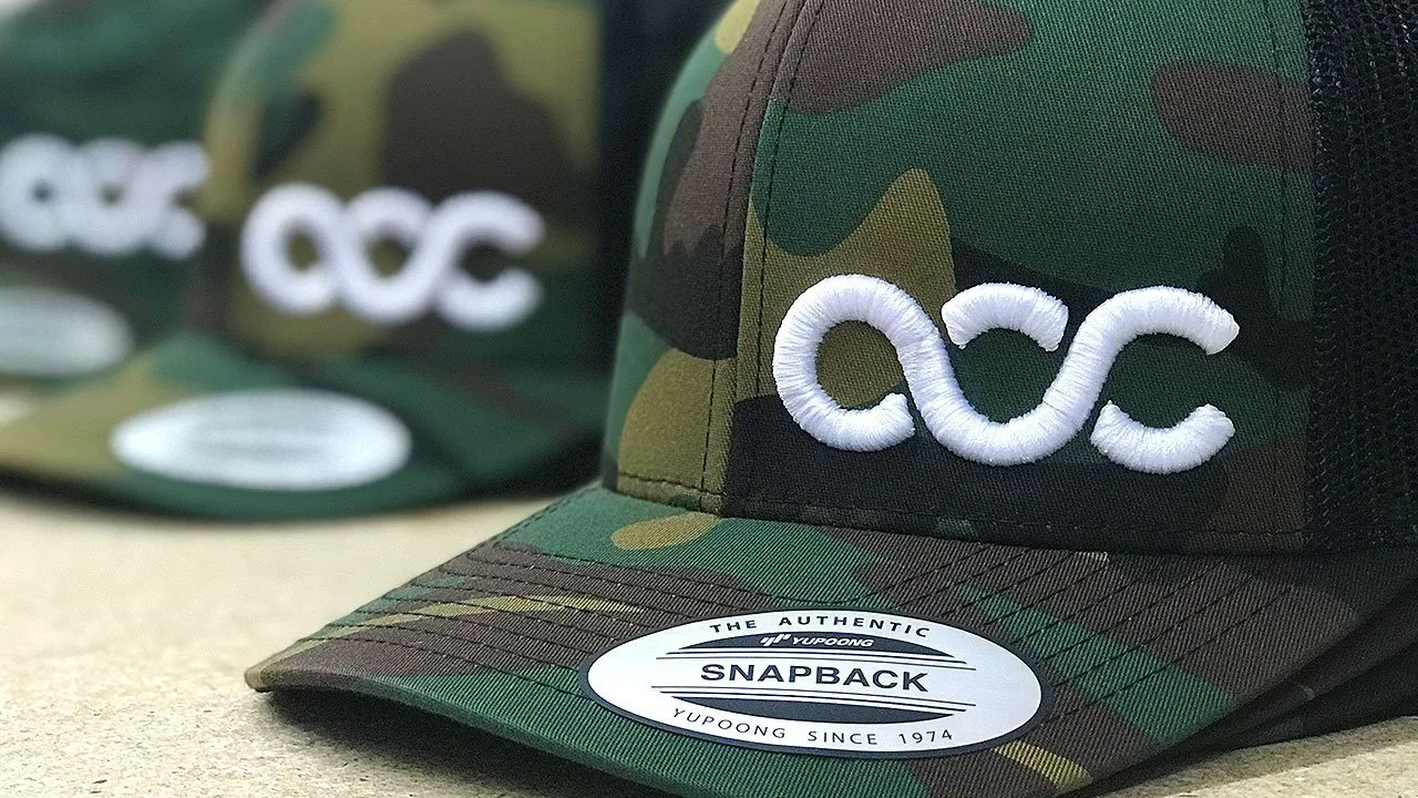 Custom Branded 3d puff embroidered caps hats UK Design by Creative, quick turnaround with low moq 12 units
